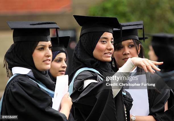 Students at the University of Birmingham pose for a group photograph as they take part in their degree congregations on July 14, 2009 in Birmingham,...