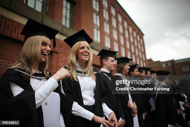 Students at the University of Birmingham pose for a group photograph as they take part in their degree congregations on July 14, 2009 in Birmingham,...