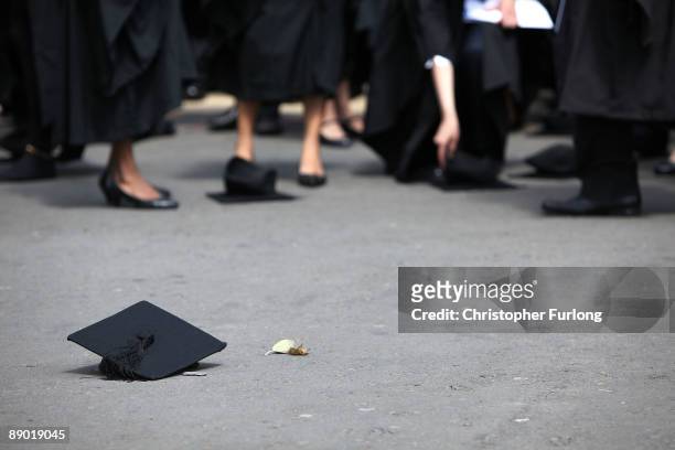 Students pick up their mortarboards after the offical hat throwing photograph at the University of Birmingham on July 14, 2009 in Birmingham,...
