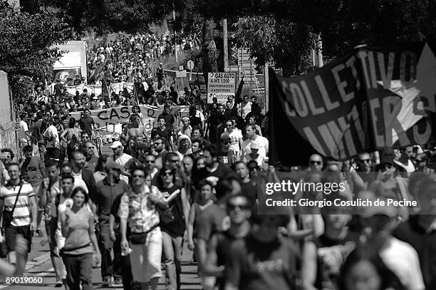 Demonstrators walk on a road towards L'Aquila during a protest against the G8 summit on the third day of the international meeting on July 10, 2009...