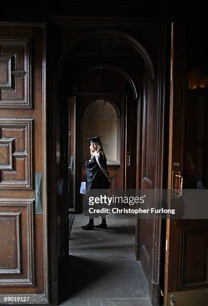 Student clutches her degree as she leaves the Great Hall at the University of Birmingham degree congregations on July 14, 2009 in Birmingham,...