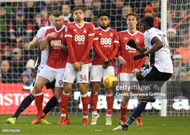 Sammy Ameobi of Bolton Wanderers takes a free kick as Darry Murphy, Tyler Walker, Liam Bridcutt and Kieran Dowell of Nottingham Forest line up in the...