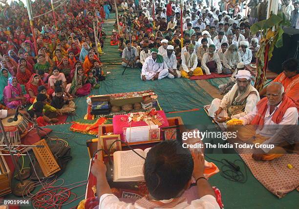 People from both Hindu and Muslim communities sitting at a Sri Bhagwat Katha session for communal harmony held at Dargah Ground in Ahmedabad,...