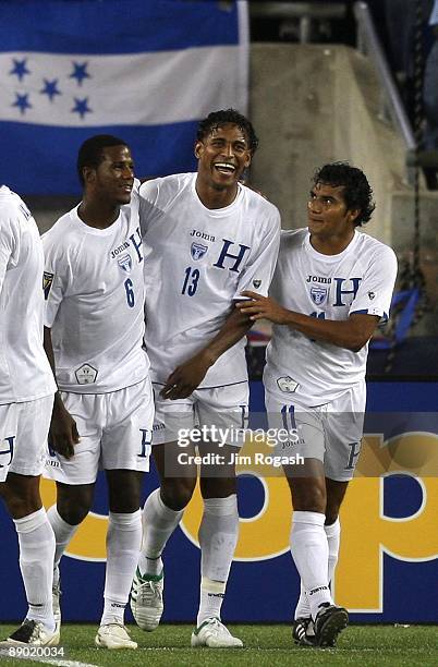 Carlo Costly of Honduras celebrates his goal with teammates Juan Carlos Garcia and Mariano Acevedo against Grenada during 2009 CONCACAF Gold Cup...
