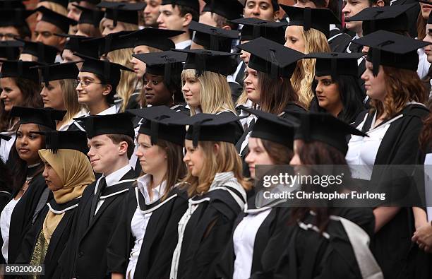 Students at the University of Birmingham pose for a group photograph as they take part in their degree congregations on July 14, 2009 in Birmingham,...