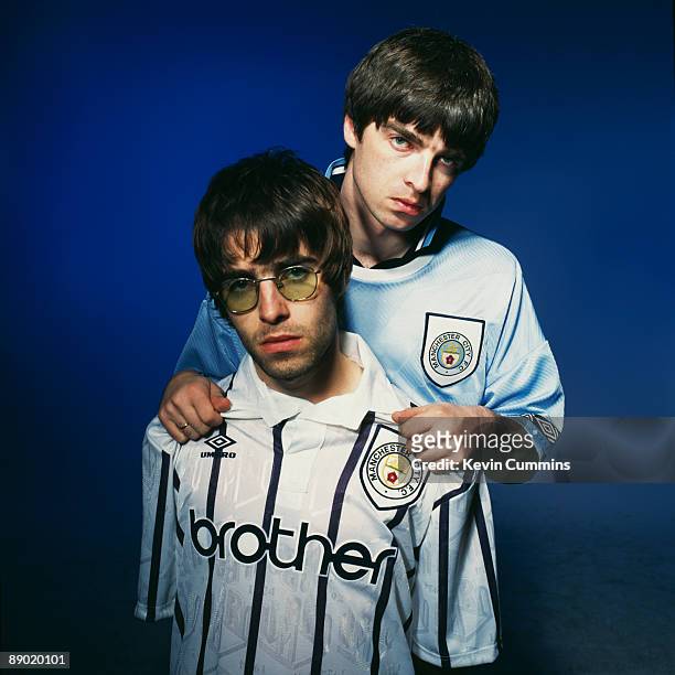 Oasis singer Liam Gallagher and his brother, guitarist Noel Gallagher , of British rock group Oasis, Portsmouth, 9th May 1994. Both are sporting...