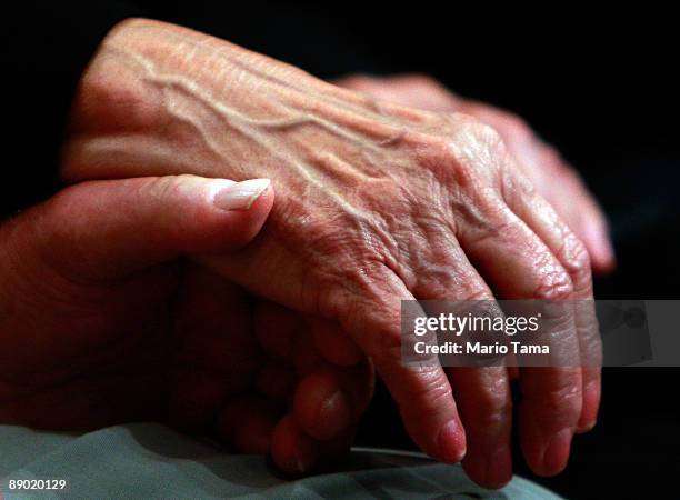 Supreme Court nominee Judge Sonia Sotomayor's mother, Celina Sotomayor, holds hands with her husband, Omar Lopez, during the second day of...