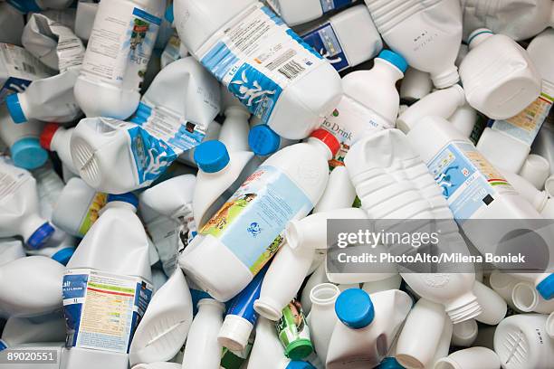 crushed plastic bottles, full frame - milk bottles stock pictures, royalty-free photos & images