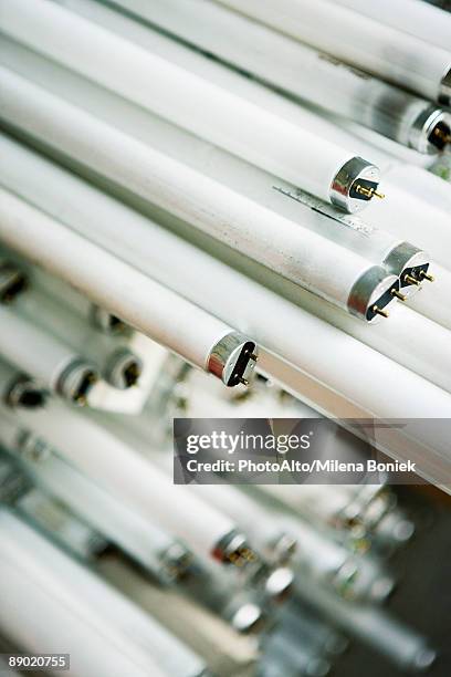 fluorescent light bulbs, full frame - fluorescent light stock pictures, royalty-free photos & images