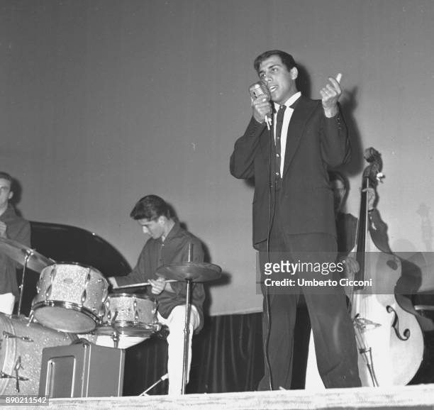 Adriano Celentano while singing on the stage, Rome 1961. Adriano Celentano is a famous Italian singer, composer, producer, comedian, actor, film...