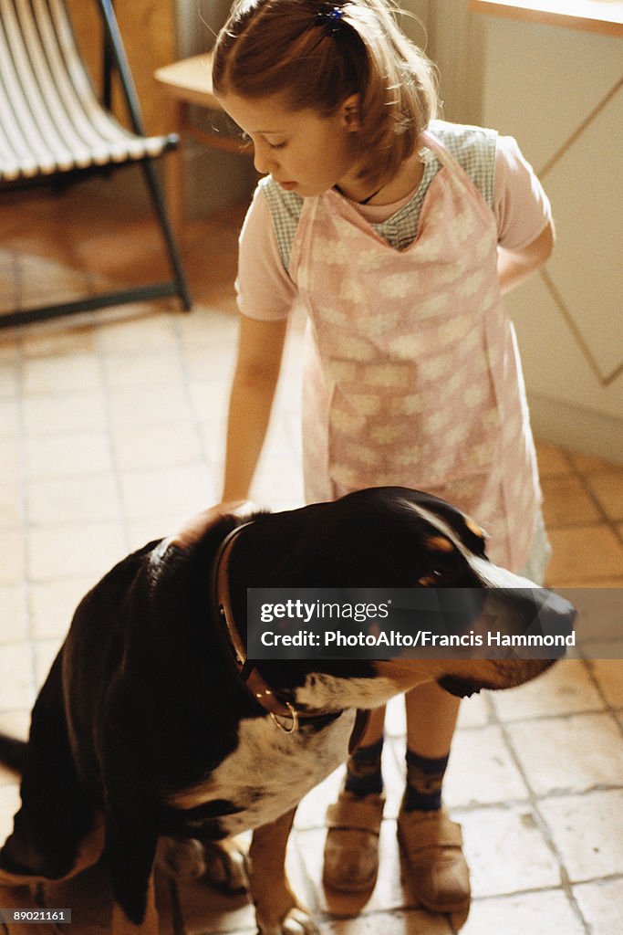 Girl petting dog