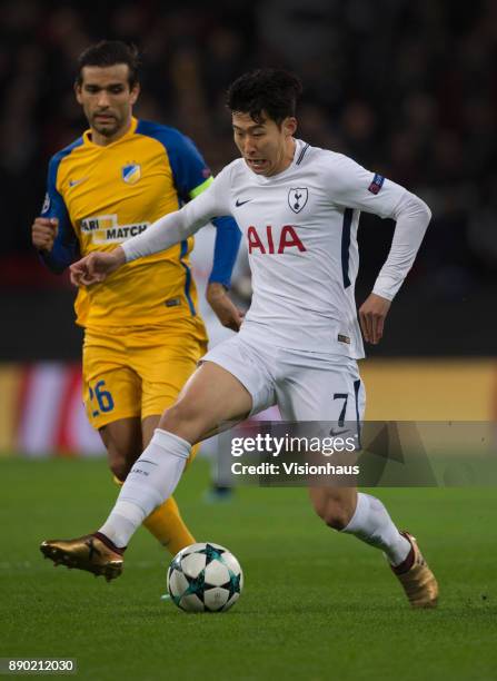 Heung-Min Son of Tottenham Hotspur and Nuno Morais of Apoel Nikosia in action during the UEFA Champions League group H match between Tottenham...