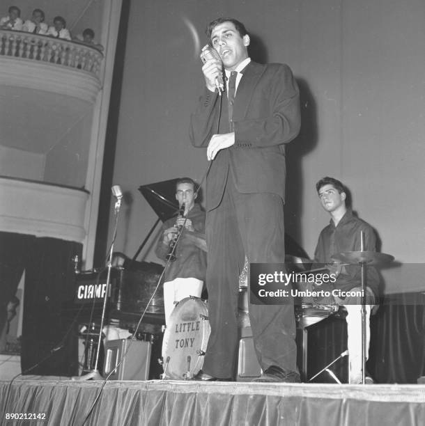 Adriano Celentano while singing on the stage, Rome 1961. Adriano Celentano is a famous Italian singer, composer, producer, comedian, actor, film...