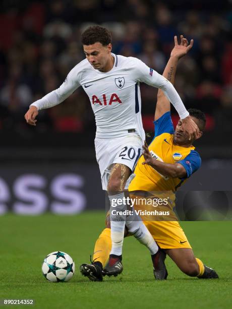 Dele Alli of Tottenham Hotspur and Lorenzo Ebecilio of Apoel Nikosia in action during the UEFA Champions League group H match between Tottenham...