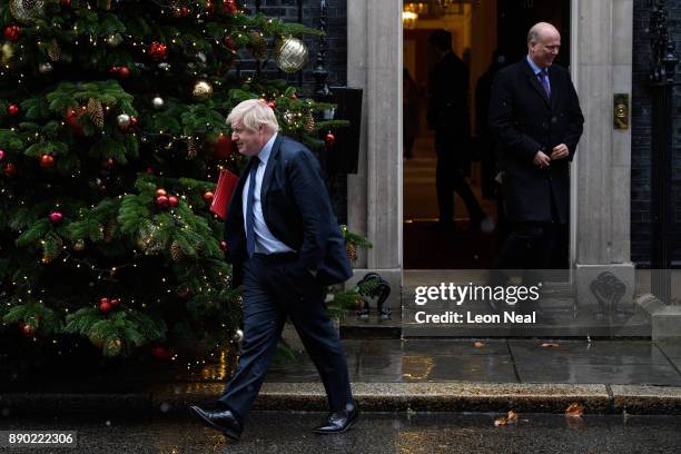 Foreign Secretary Boris Johnson and Transport Secretary Chris Grayling leave Downing Street, following a cabinet meeting on December 11, 2017 in...