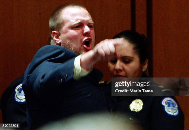 Protester is removed during the second day of confirmation hearings for Supreme Court nominee Judge Sonia Sotomayor July 14, 2009 in Washington, DC....