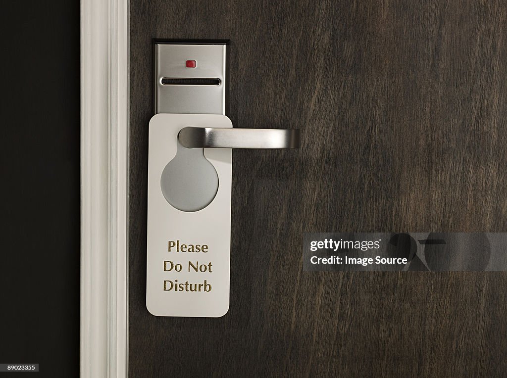 Do not disturb sign on a hotel room door