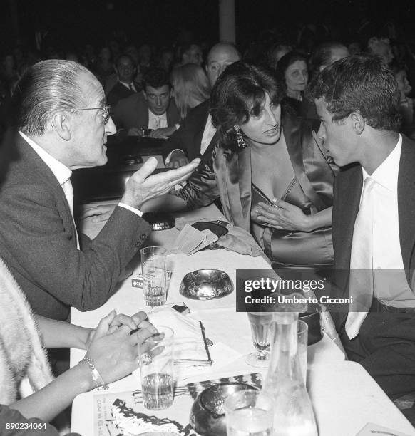 Italian actress Anna Magnani is with her son Luca and Italian comedian Totò at 'Casina delle Rose' for the Italian film award 'Nastri D'Argento',...