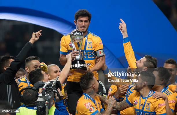 Damian Alvarez of Togres lifts the champions trophy during the Final second leg match between Monterrey and Tigres UANL as part of the Torneo...