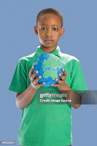 boy with globe - papier stock pictures, royalty-free photos & images