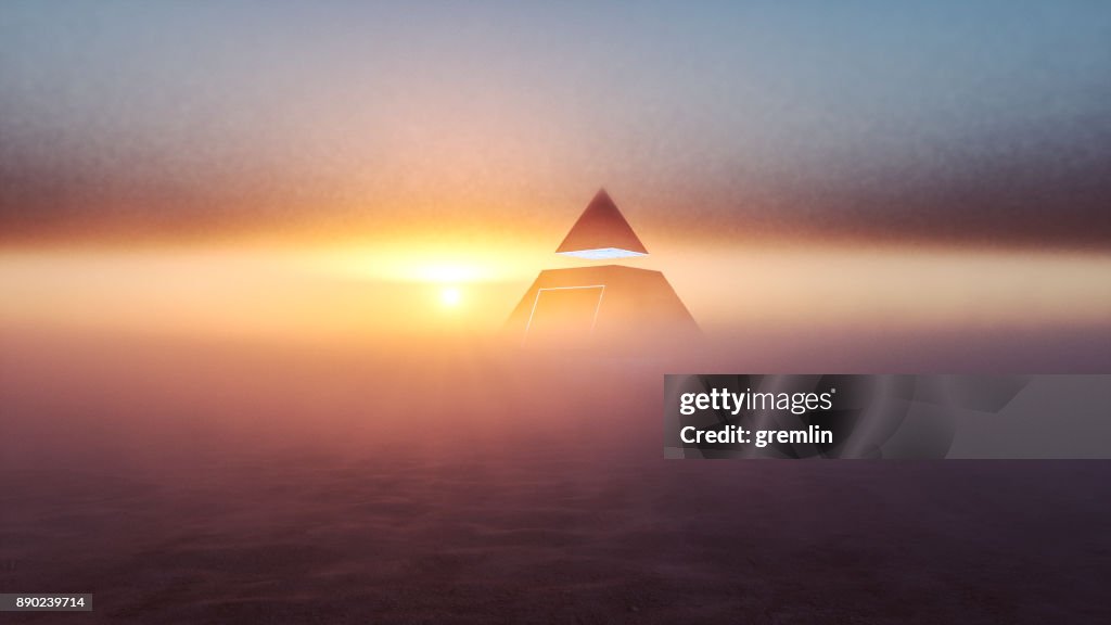 Mysterious alien pyramid in the desert at sunset