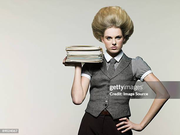 businesswoman holding files - beehive hair stock pictures, royalty-free photos & images