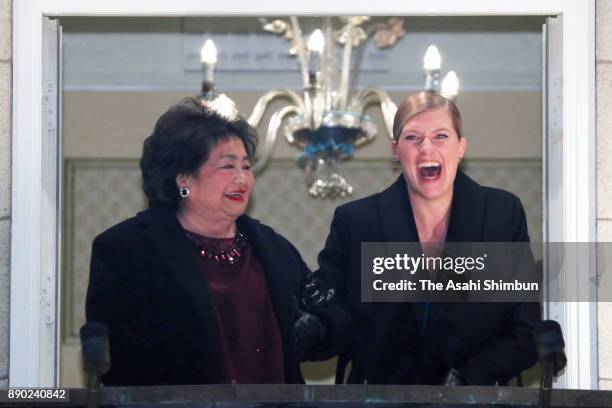 Beatrice Fihn, Executive Director International Campaign to Abolish Nuclear Weapons and Setsuko Thurlow wave prior to the dinner at the Grand Hotel...