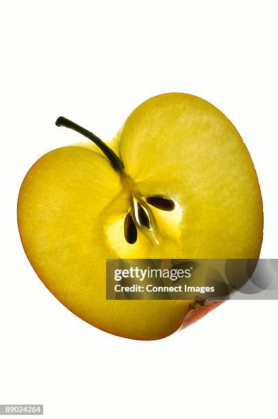 slice of apple on white background - back lit stock pictures, royalty-free photos & images