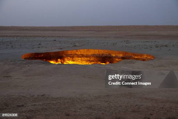 fire burning in pit in desert - turkmenistan stock pictures, royalty-free photos & images