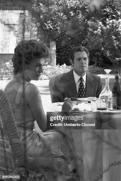 Actor Marcello Mastroianni and actress Jacqueline Bisset acting during the filming of movie 'The Sunday Woman' , Rome 1975.