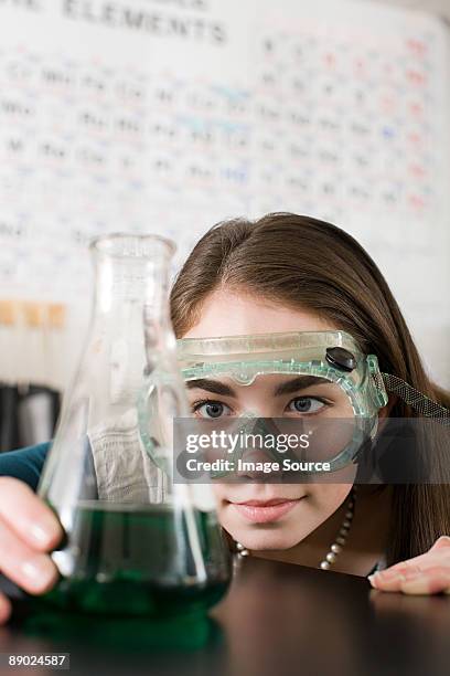 girl in science class - periodensystem der elemente stock-fotos und bilder