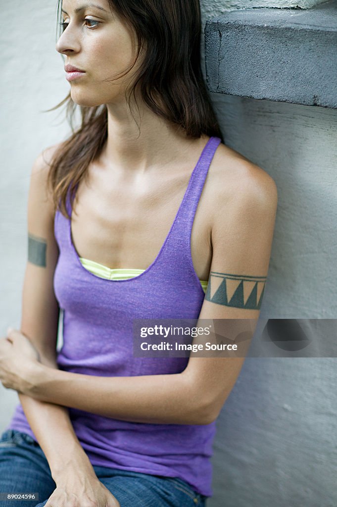 Woman with a tattoo on her arm