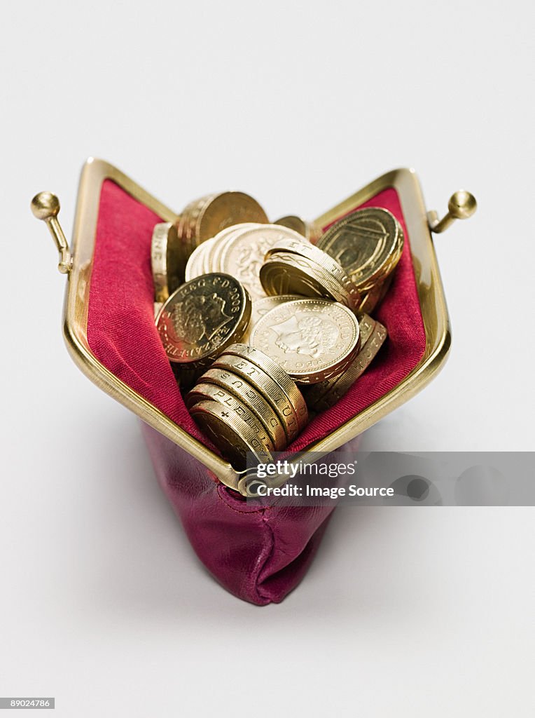 Pound coins in a purse