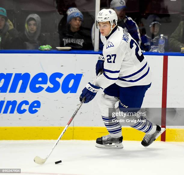 Jacob Moverare of the Mississauga Steelheads controls the puck against the Barrie Colts during OHL game action on December 8, 2017 at Hershey Centre...