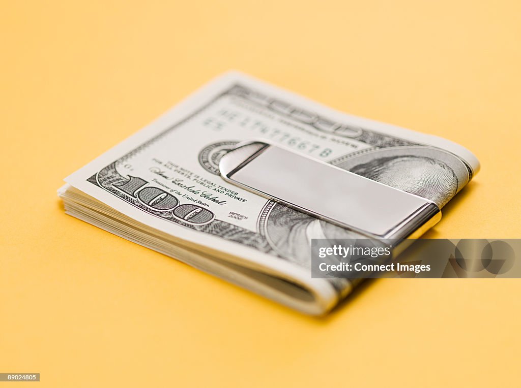 One hundred dollar bills in clip