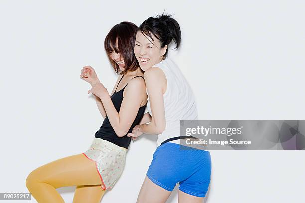 young women having fun - woman shorts stock pictures, royalty-free photos & images