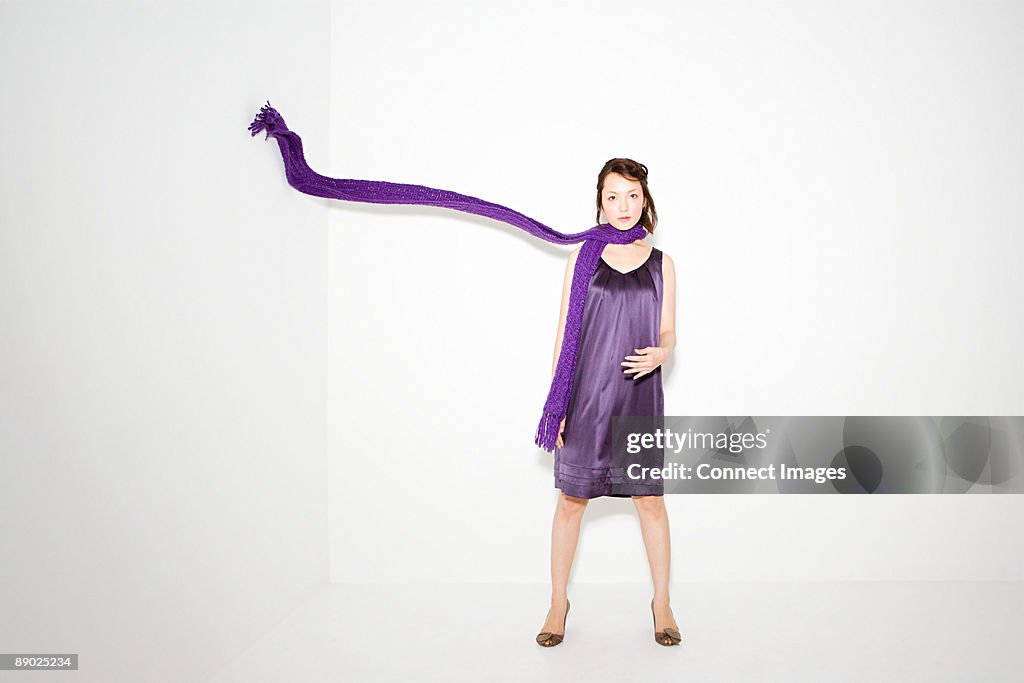 Woman with scarf in mid air