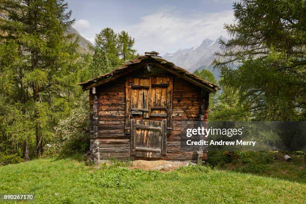 traditional wooden barn or hut in the mountains above zermatt, switzerland, swiss alps - cabin fotografías e imágenes de stock