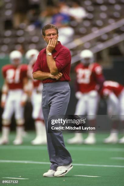 Joe Bugel, head coach Phoenix Cardinals, looks on before a NFL football game against the Philadelphia Eagles on September 15, 1990 at Veterans...