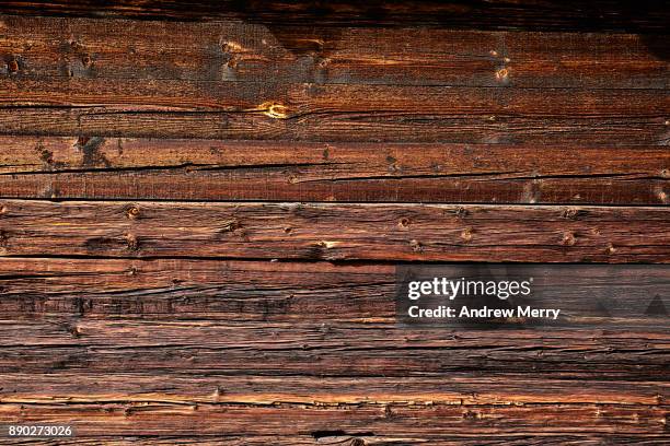 detail of historic wooden barn, chalet or hut in the mountains above zermatt, switzerland, swiss alps - cabaña de madera fotografías e imágenes de stock