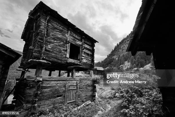 historic wooden barn, chalet or hut in the mountains above zermatt, switzerland, swiss alps - hütte stock-fotos und bilder