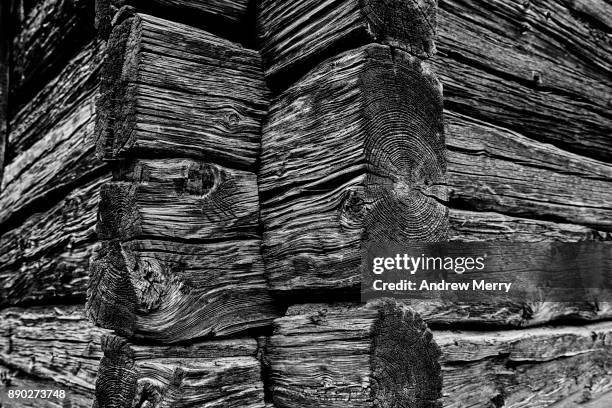 close-up of timber blocks and wood-grain from historic wooden barn, chalet or hut in the mountains above zermatt, switzerland, swiss alps - alpine larch stock pictures, royalty-free photos & images