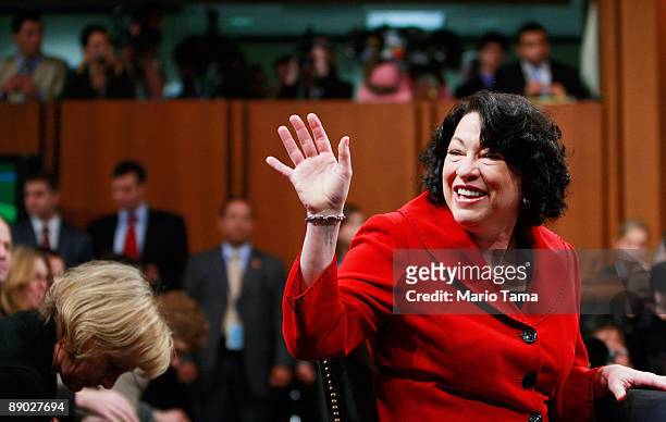 Supreme Court nominee, Judge Sonia Sotomayor waves to family members on the second day of her confirmation hearings before the U.S. Senate Judiciary...