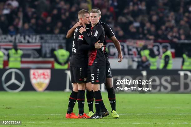 Lars Bender of Bayer Leverkusen, Sven Bender of Bayer Leverkusen and Jonathan Tah of Bayer Leverkusen celebrate after winning the Bundesliga match...