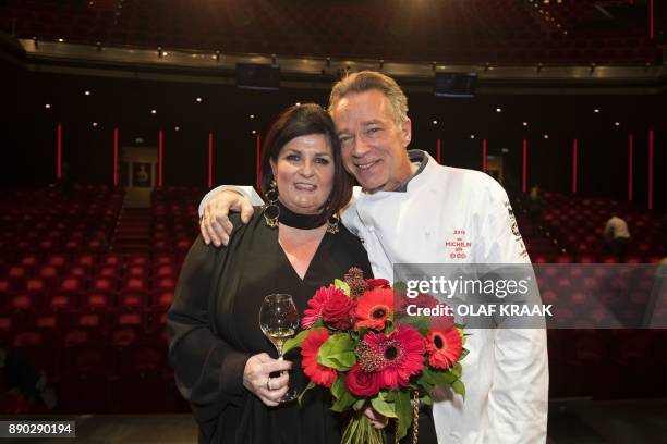 Chef Jannis Brevet and his wife Claudia, of the restaurant Inter Scaldes pose after they received a third Michelin star in Amsterdam on December 11,...