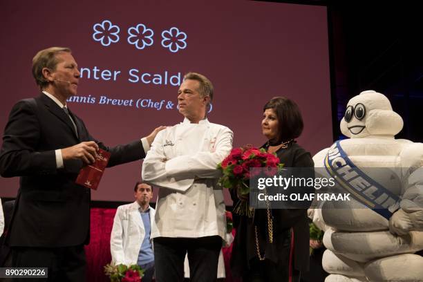 Chef Jannis Brevet and his wife Claudia , of the restaurant Inter Scaldes receive a third Michelin star from Michael Ellis of Michelin in Amsterdam...