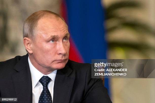 Russian President Vladimir Putin looks on during a press conference with his Egyptian counterpart following their talks at the presidential palace in...