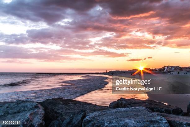 sunset clouds over long beach ny - long beach new york stock pictures, royalty-free photos & images