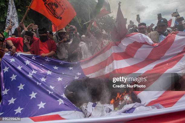 Indonesian muslim burn Israeli and U.S. Flags during a protest in front of U.S Embassy in Jakarta, Indonesia, on December 11, 2017 against the U.S....