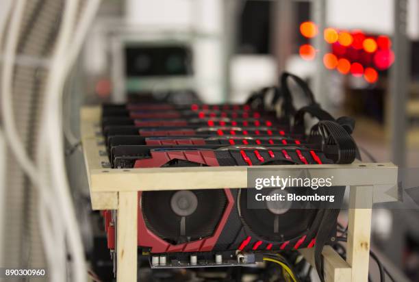 Cryptocurrency mining rigs operate on shelves at the SberBit mining 'hotel' in Moscow, Russia, on Saturday, Dec. 9, 2017. Futures on the worlds most...